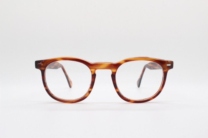 80s vintage modified wayfarer style glasses. Tortoise optical frames with keyhole bridge and clear lenses. 40s, 50s style NOS eyeglasses