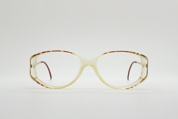 Valentino 90s vintage eye glasses made in Italy. Crystal and abstract pattern optical frames with golden forked arms. Prescription RX