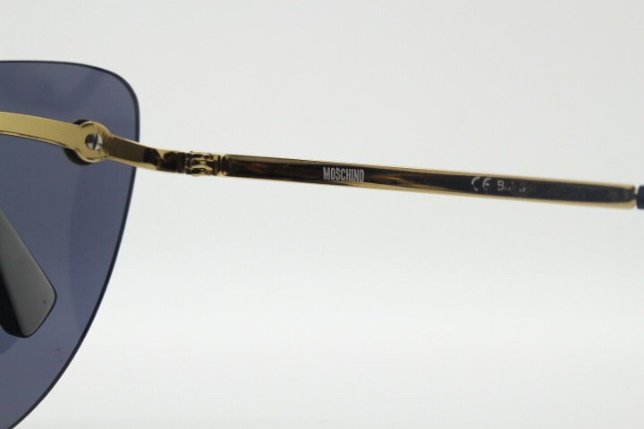 Moschino oval cat eye sunglasses model 082/S. Womens frameless cateye in perfect proportions with golden metal brow line