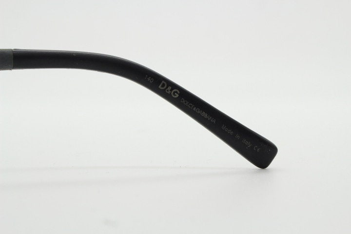 Dolce and Gabbana gum sunglasses made in Italy. Mens 90s vintage innovative flexible grey rubber frame with black lenses