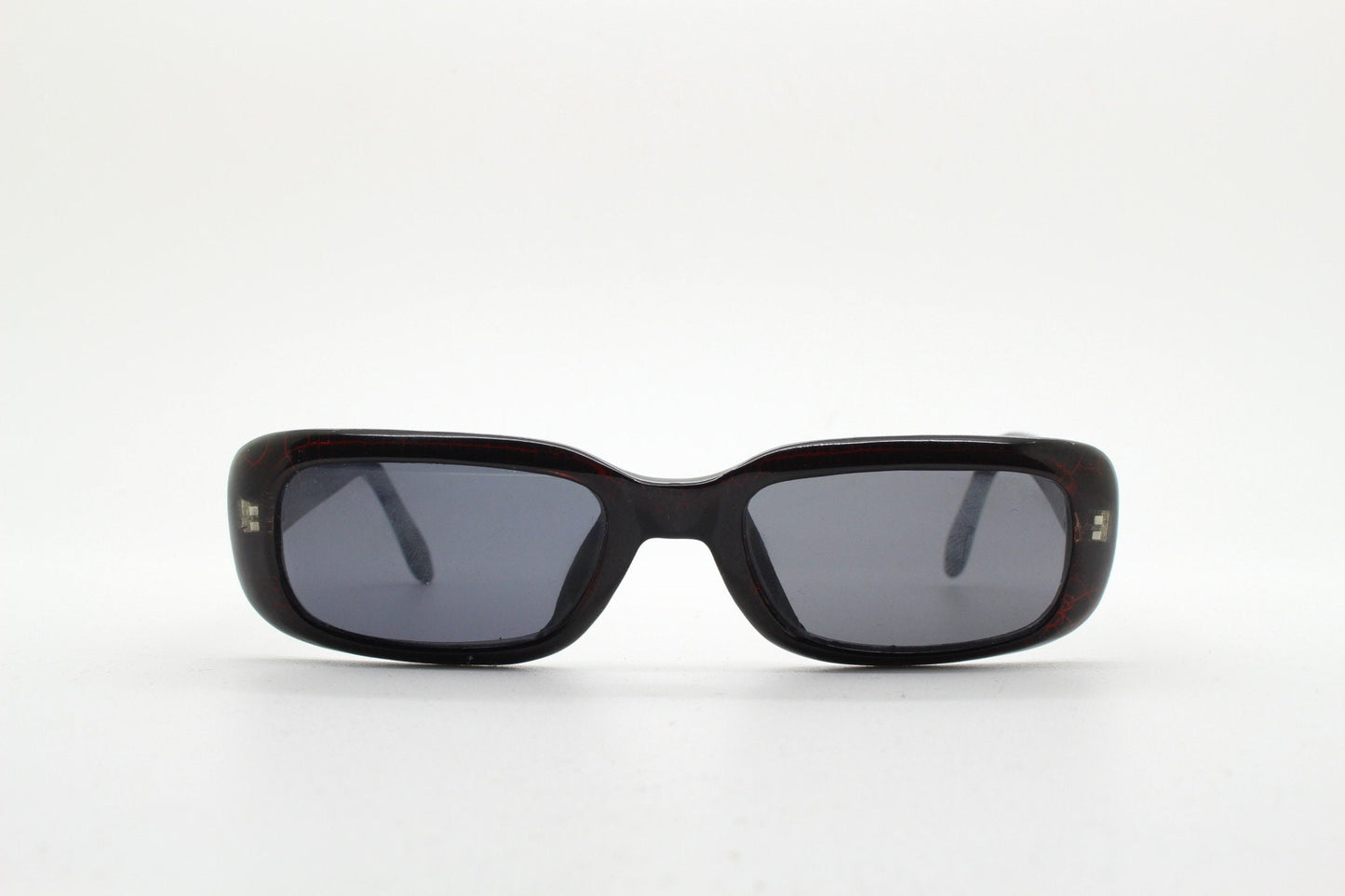 90s authentic vintage abstract rectangular sunglasses. Thickened black frame with red crackle print. NOS