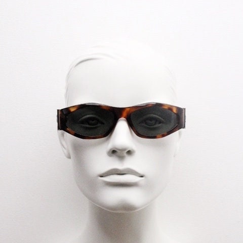 90s vintage oval sunglasses. Low profile transparent tortoise frame with massive bronze metal arm crests BNWT. Unused NOS
