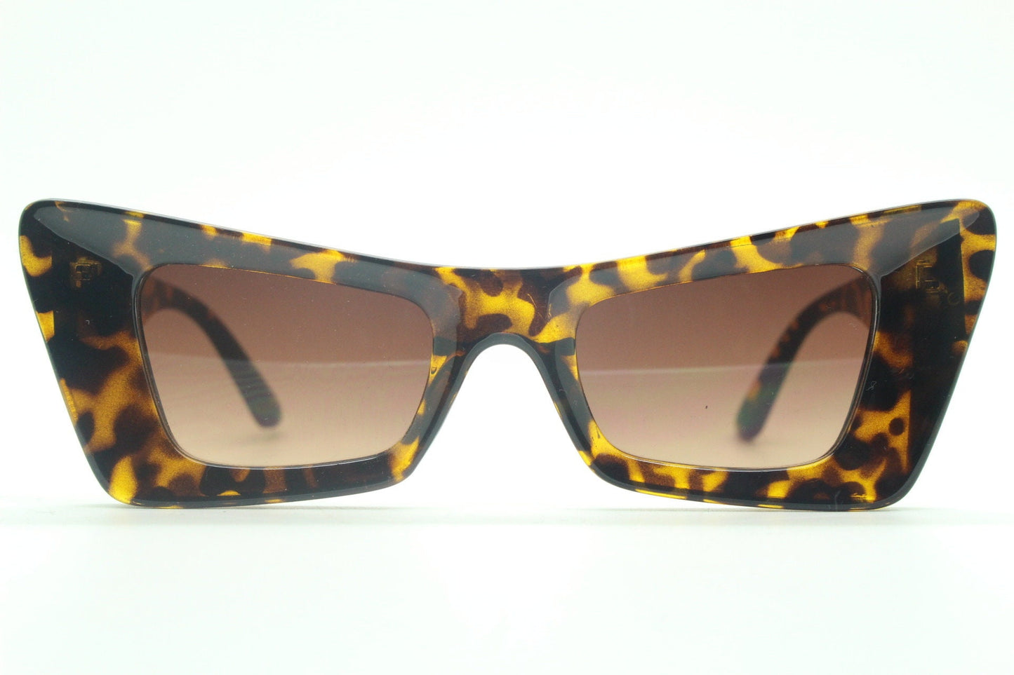 Y2K vintage dynamic winged cat eye sunglasses. Women's tortoise thick concave angled frame with graduating lenses. 2000s BNWT