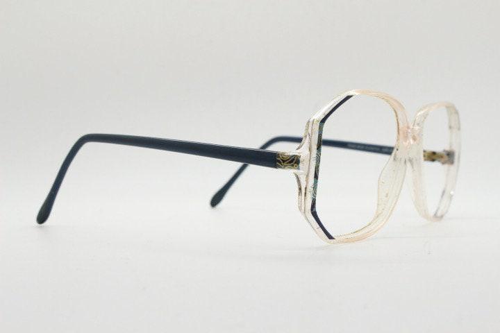 Silhouette 80s vintage hexagon eye glasses made in Austria. Transparent crystal optical frame with abstract blue pattern. Prescription. 70s
