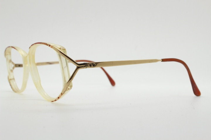 Valentino 90s vintage eye glasses made in Italy. Crystal and abstract pattern optical frames with golden forked arms. Prescription RX