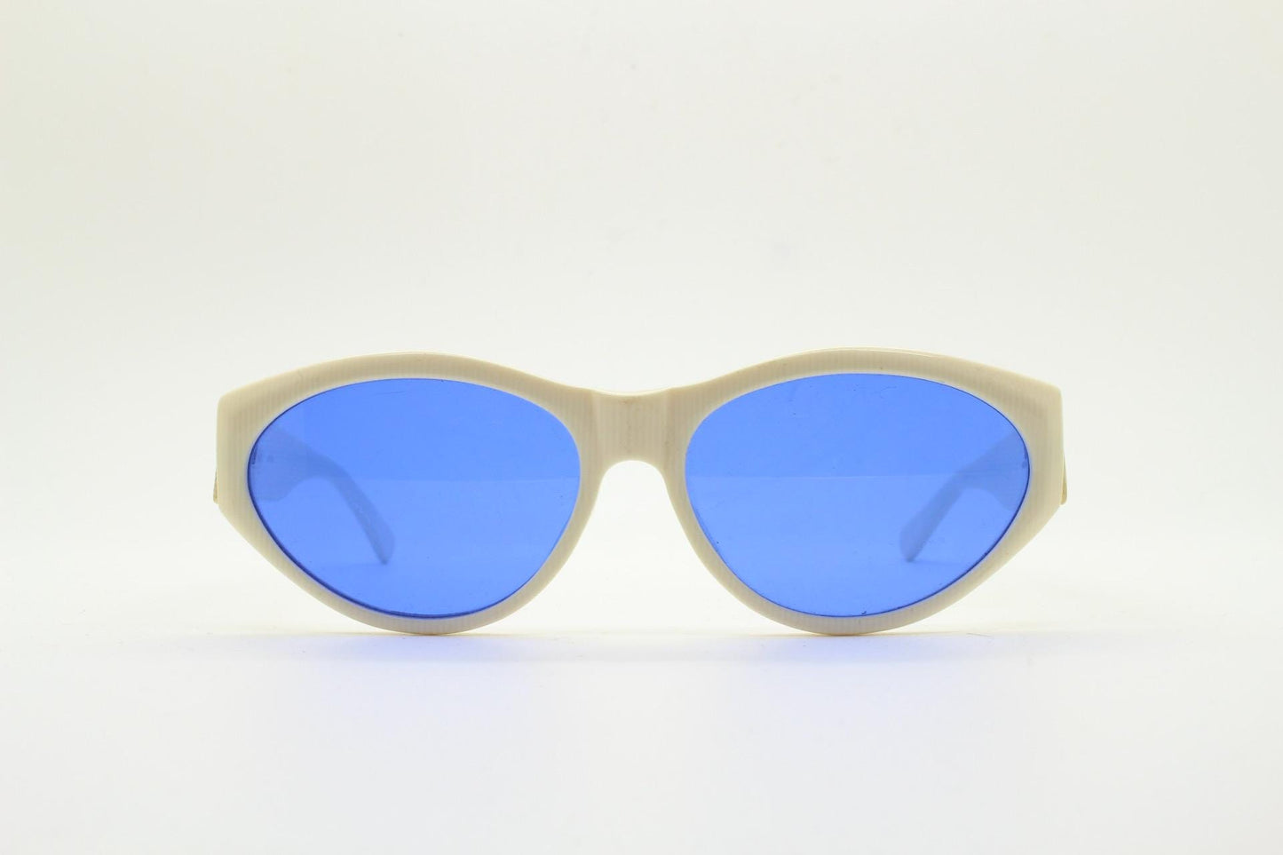 Benson and Ashley vintage 80s cat eye sunglasses hand made in England. 50s design white acetate cateye frame with cobalt blue lenses. NOS