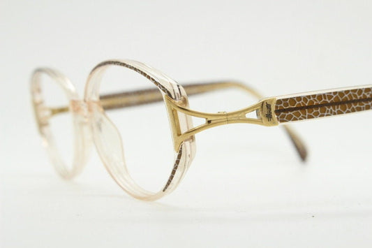 Silhouette 80s vintage oval eye glasses made in Austria. Transparent crystal optical frame with giraffe arm print. Prescription RX