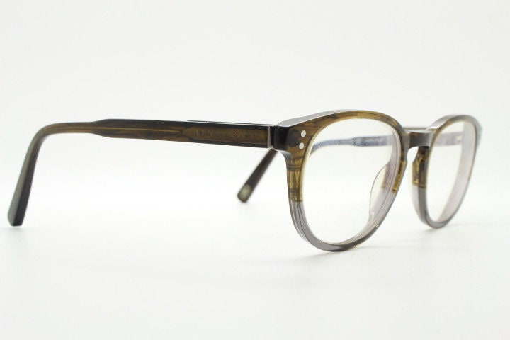 Land Rover vintage round 40s design eye glasses.Mottled brown and grey acetate optical frame with keyhole bridge. Prescription RX
