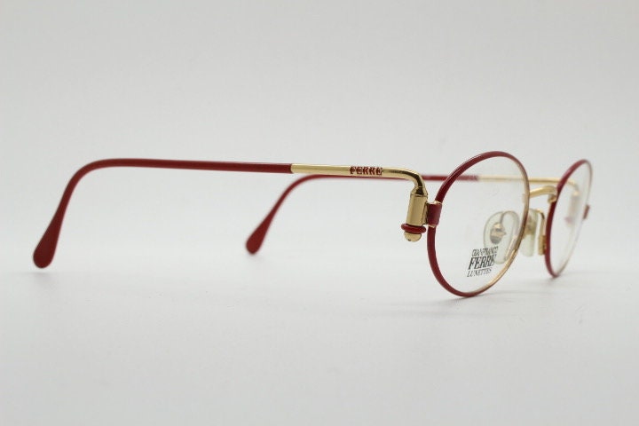 Gianfranco Ferre 90s vintage oval eye glasses made in Italy. Red and gold metal tech design optical frame. Prescription RX. NOS