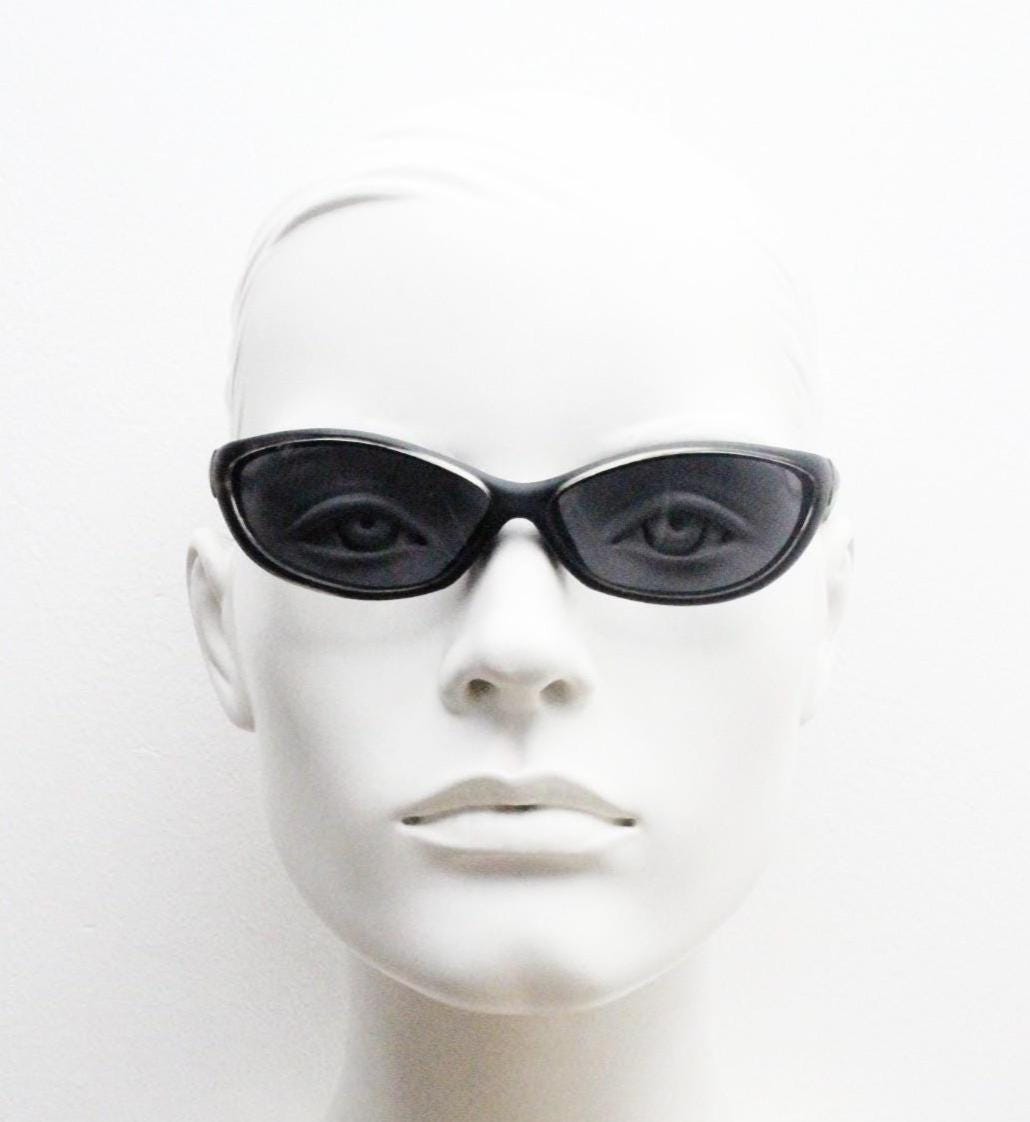90s vintage curved wraparound sunglasses. Aerodynamic low profile transparent grey frosted frame. Minimal sporty shield design. NOS