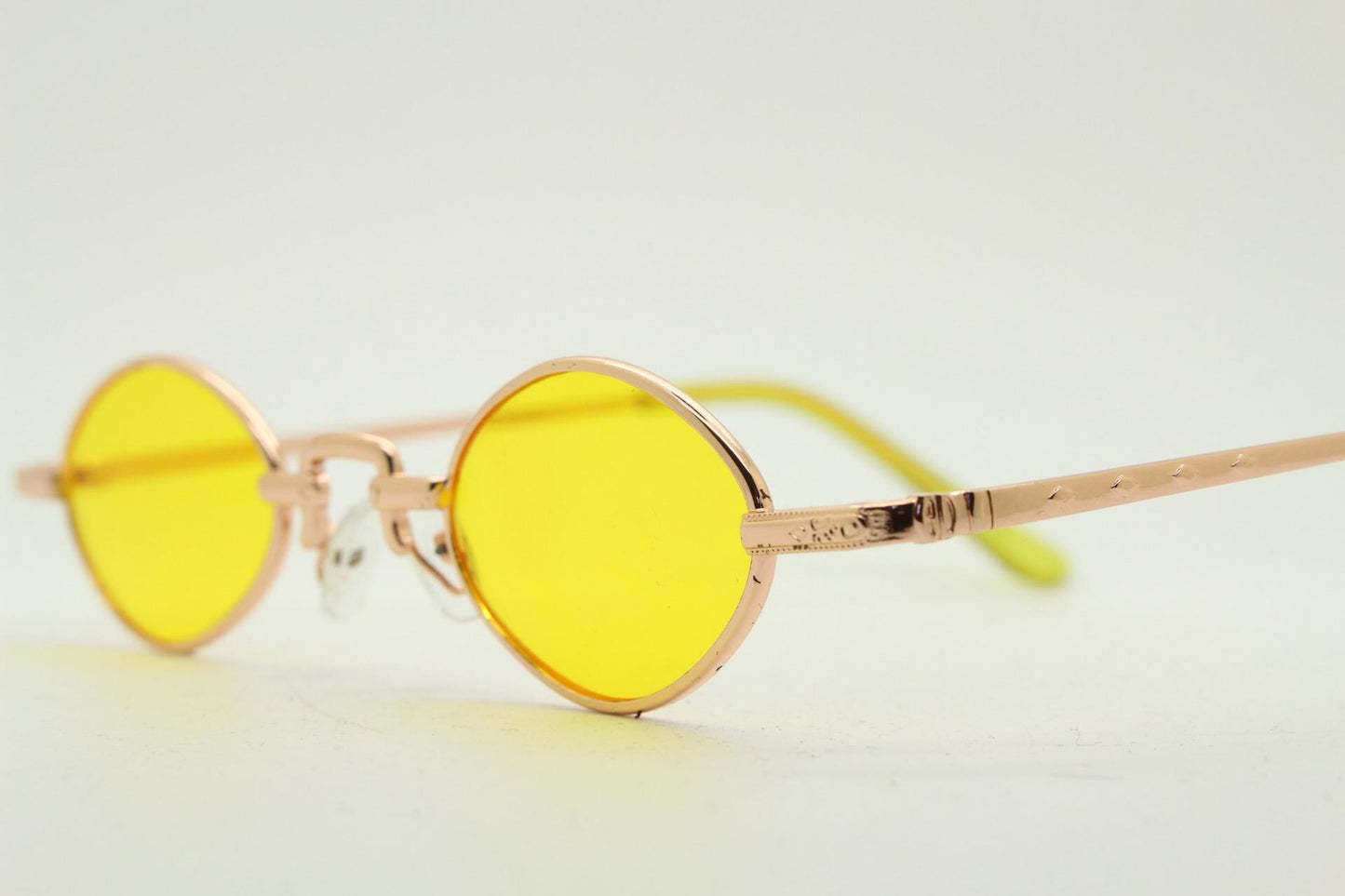 90s vintage small oval sunglasses. Imposing minimal rose gold metal victorian style frame with yellow lenses. Steampunk. BNWT