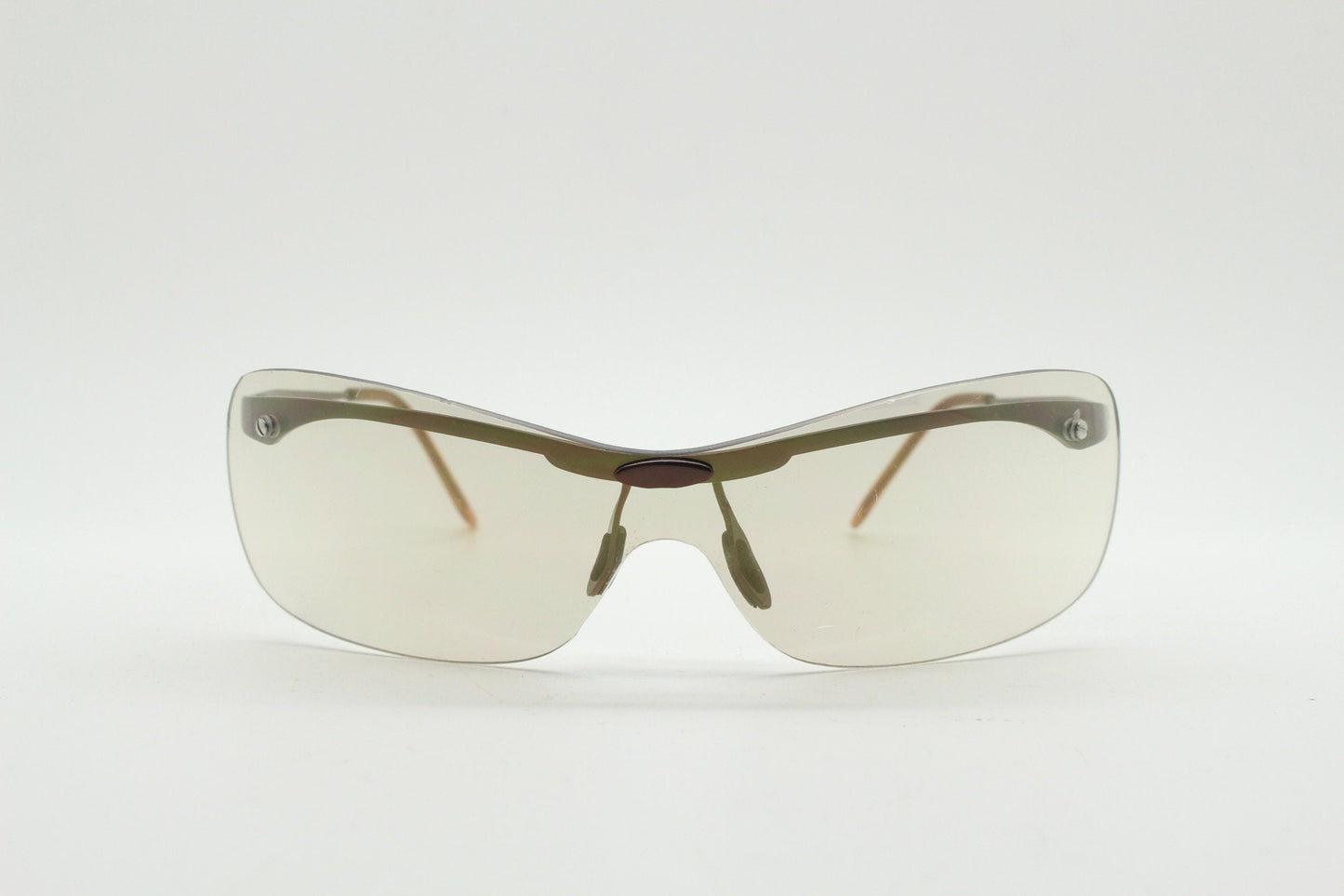 Y2K vintage visor sunglasses. 2000's wrap around sport shield design. Brown chrome brow with light tone lens. NOS 00's. 90S