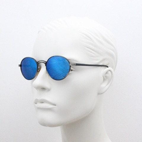 90s vintage oval panto sunglasses. Brushed bronze metal frame with cool blue mirror lenses and black slender arms. Unused NOS