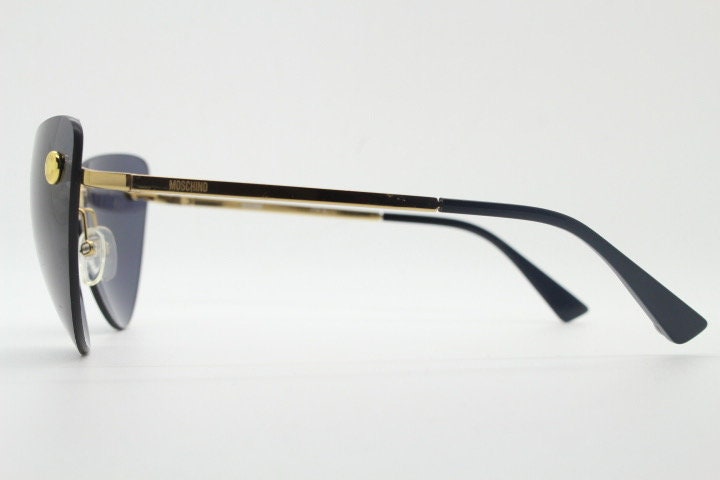Moschino oval cat eye sunglasses model 082/S. Womens frameless cateye in perfect proportions with golden metal brow line