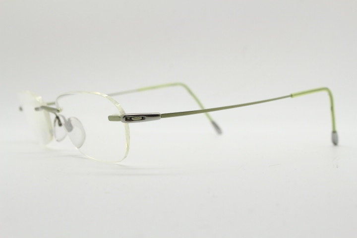 Silhouette rectangular frameless eye glasses made in Austria. Minimal lightweight optical frame with silver trim. Prescription RX