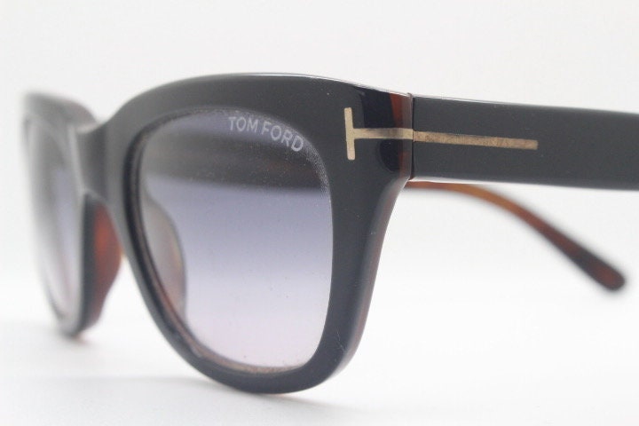 Tom Ford vintage modified wayfarer sunglasses made in Italy. Slightly cat eye form in black gloss acetate with superb graduating lenses
