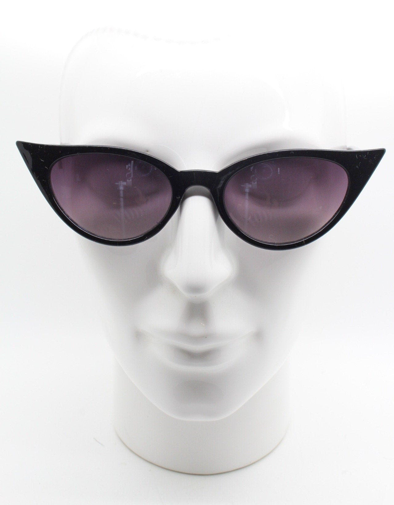 Y2K vintage pointed cat eye sunglasses. Black slender frame with graduated lenses. Womens 50s style rockabilly, pin up shades