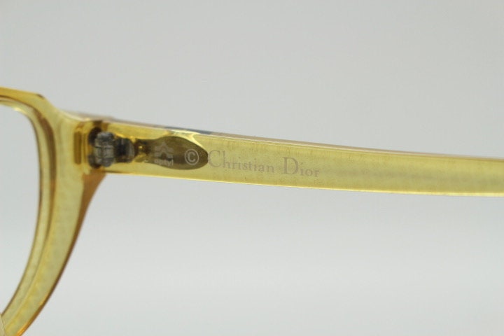 Christian Dior 80s vintage flat top cat eye glasses made in Germany. Transparent yellow optical frame with abstract print. Prescription RX