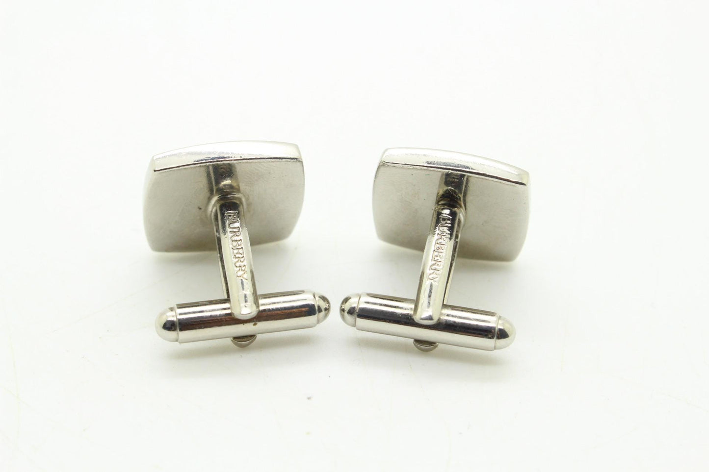 Burberry vintage square cuff links made in England with signature house check. Solid metal with blue on one side, black on the other. NOS