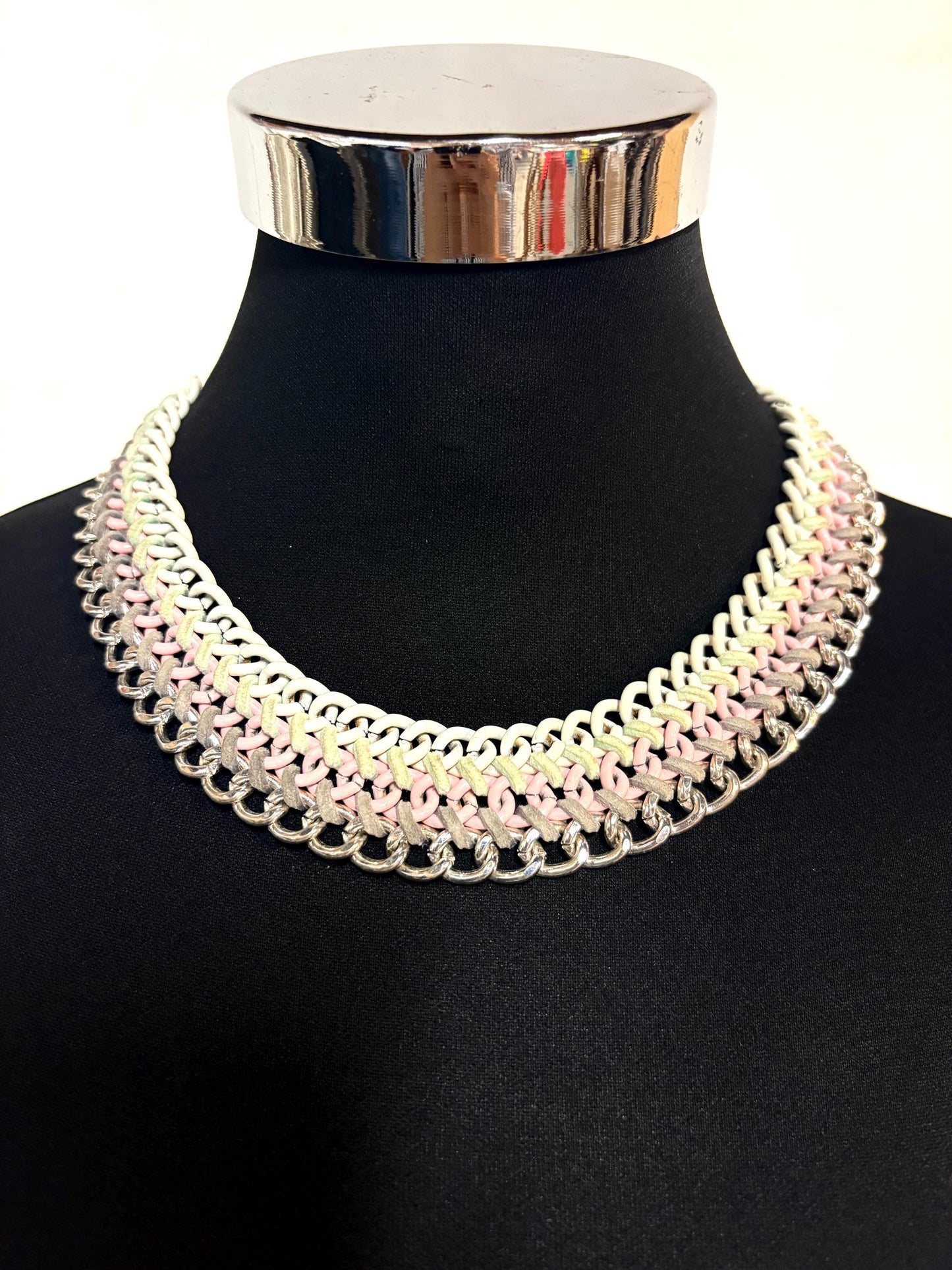 90s vintage 3 tier chain necklace. Solid metal construction in silver, pink, and white tones with grey rubber bonds. Adjustable back