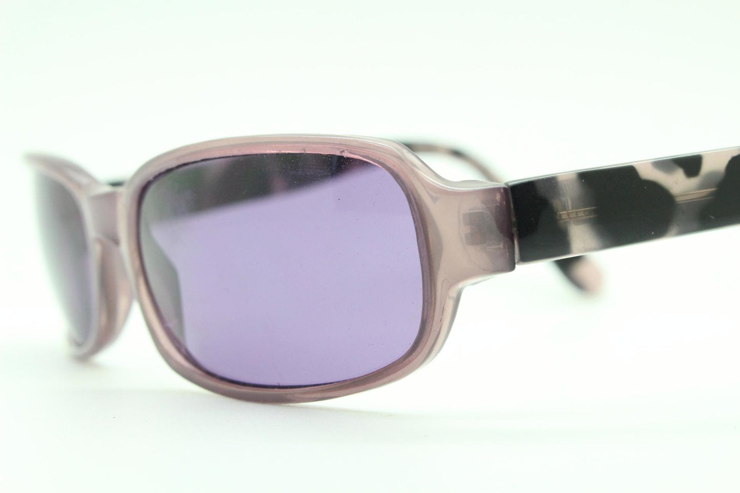 Y2k vintage wrap around sunglasses. Curved low profile frame with extraordinary purple turtle arms and well matched lenses. 2000's NOS