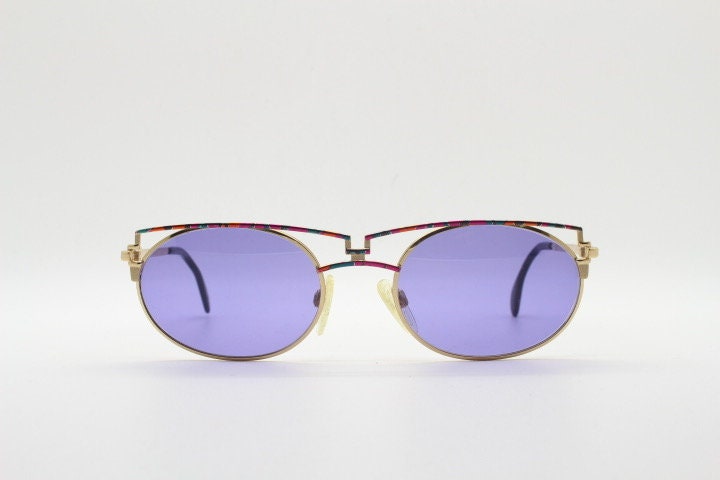 Cazal 90s vintage sunglasses made in Germany. Dynamic multi colour enamelled frame with custom ordered unique purple lenses