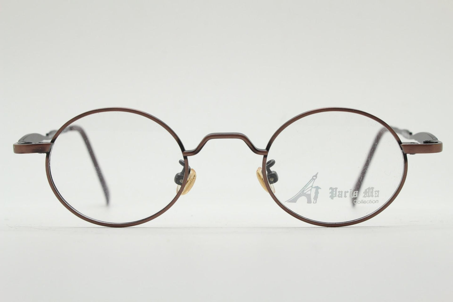 Paris Ma 90s vintage small oval eye glasses. Brushed bronze optical frames with scrolled arm details. Prescription. Steampunk spectacles NOS
