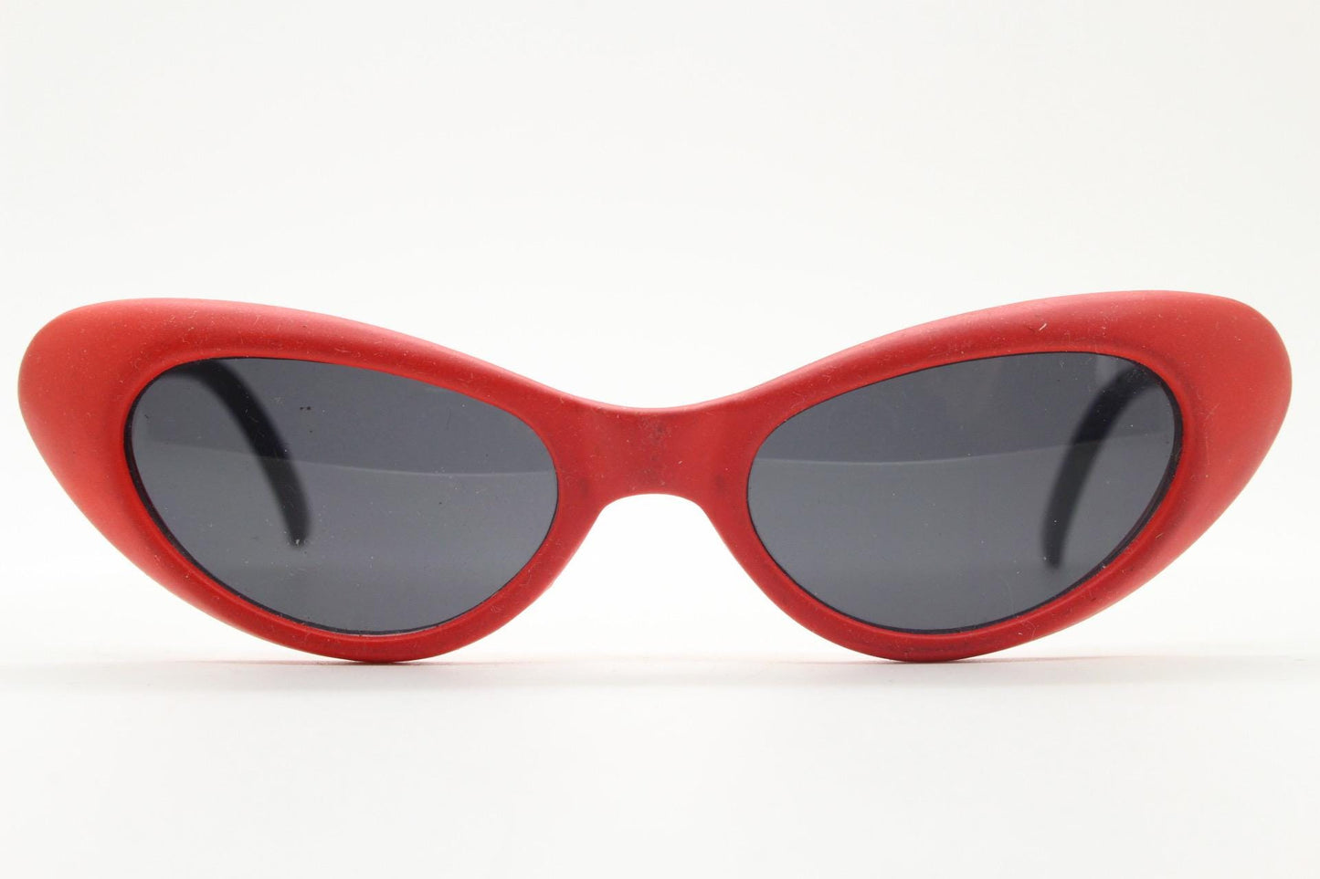 Vintage 80s oval cat eye sunglasses. Dynamic red rubber front with black gloss arms. Hyper real cosplay cateye. New wave punk