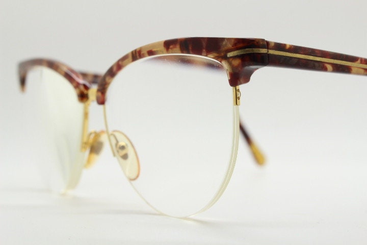 Versace 90s vintage brow line cat eye glasses made in Italy. Elegant tortoise acetate cateye optical half frames. Prescription RX eyeglasses
