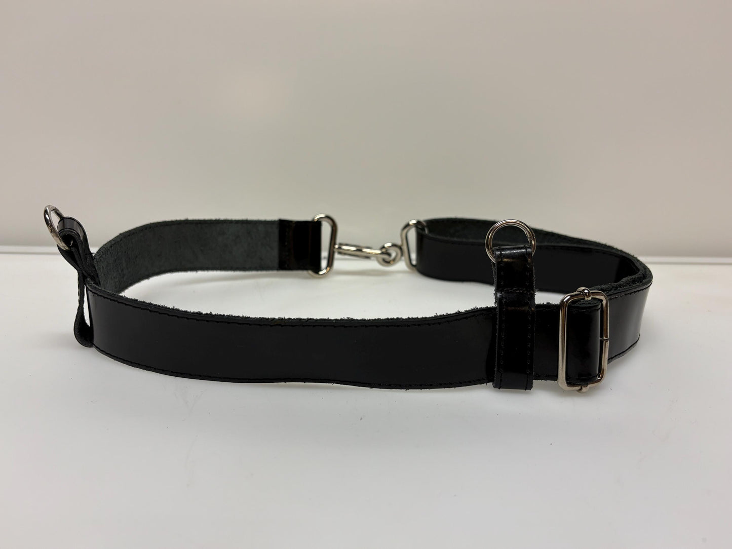 90s vintage womens shiny fetish army style belt made in Italy. Black patent leather with shoulder  strap attachments. Kinky costume. NOS
