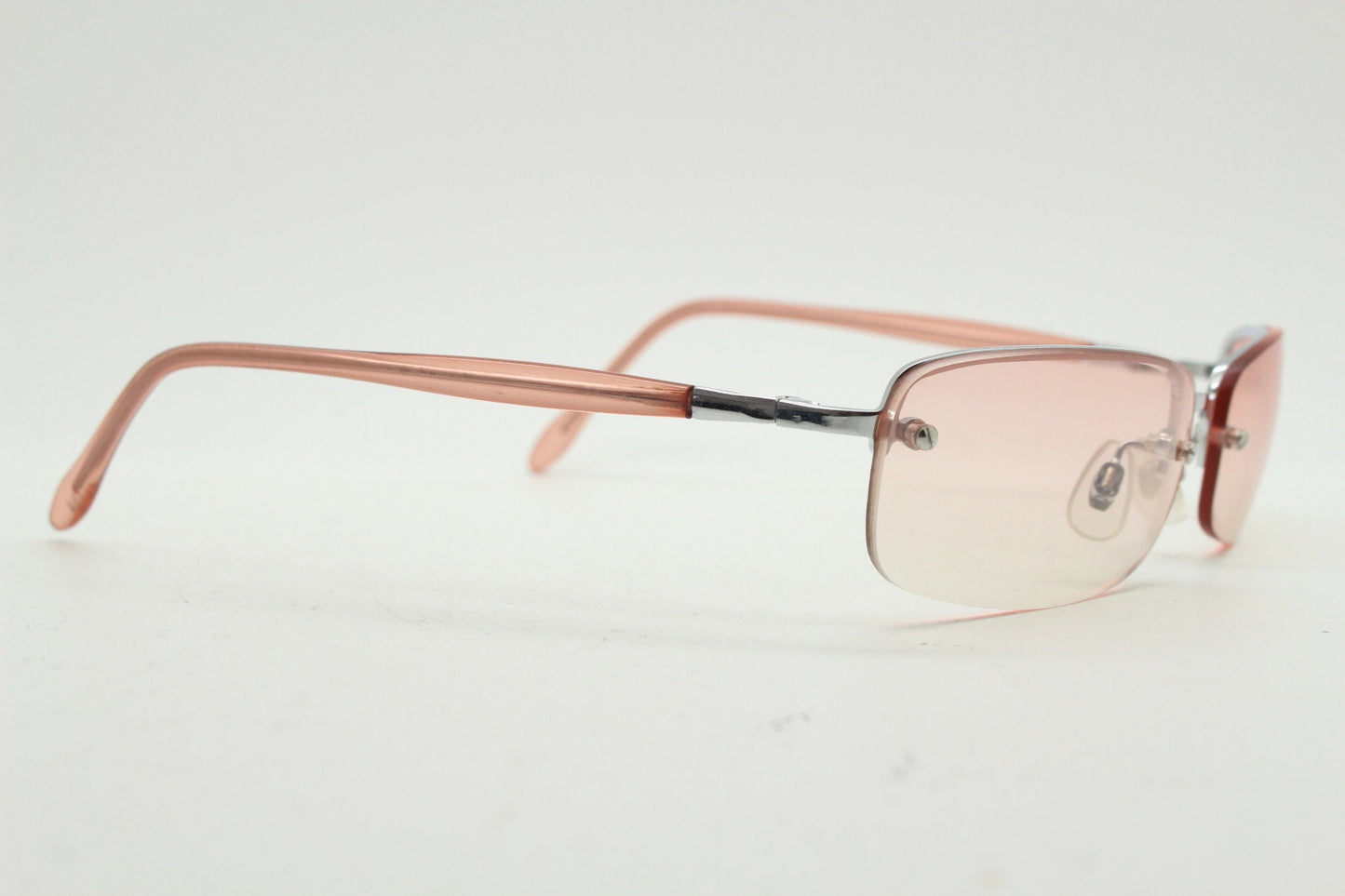 Y2K vintage wrap around rectangular sunglasses. Half frame in sharp chrome with extra light tone pink lenses. Rave 2000's. 00's NOS
