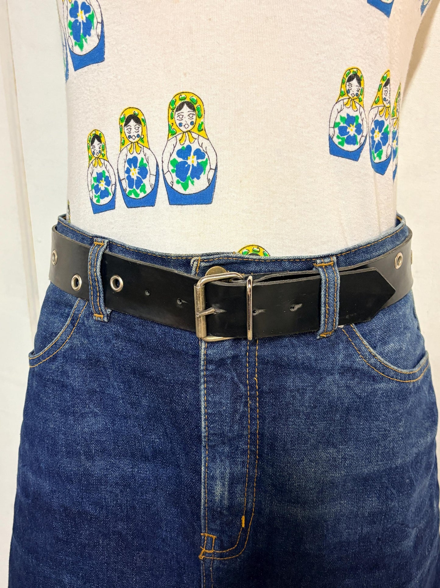 Y2k vintage womens jeans belt with silver buckle and scattered round lace holes. Thick black vinyl. Can be worn with a dress. 2000s NOS