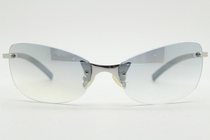 Y2K vintage wraparound sunglasses. Low profile frameless design in black matt finish with light tone graduated mirror lenses. 2000's. NOS