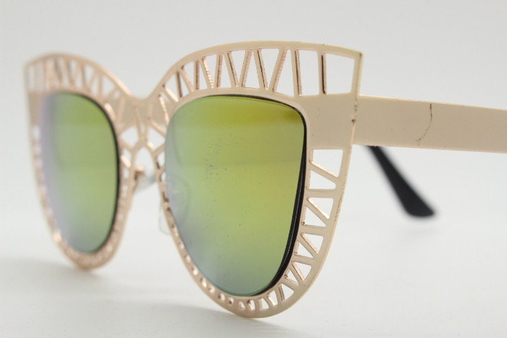 Y2K vintage metal cat eye sunglasses. Women's extraordinary gold cut out lattice scaffold cateye frame with gold mirror lenses. 2000s. BNWT