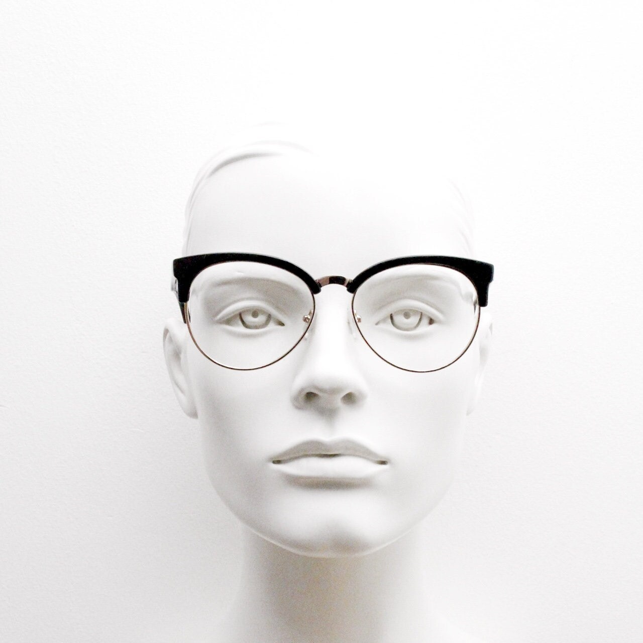 90s vintage modified cat eye glasses. Black gloss browline half frame eyeglasses with gold underwire. 50s, 60s design cateye. NOS