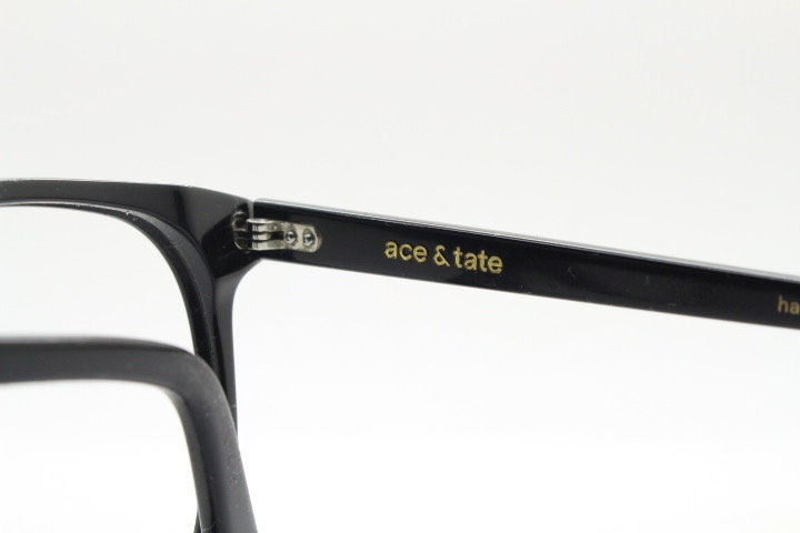Ace and Tate slim wayfarer design eye glasses made in Italy. Plain black gloss acetate optical frames. Prescription RX