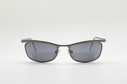Y2K vintage curved oval sunglasses. Minimal grey chrome metal aerodynamic sport shaped frame. 2000's. 00's NOS