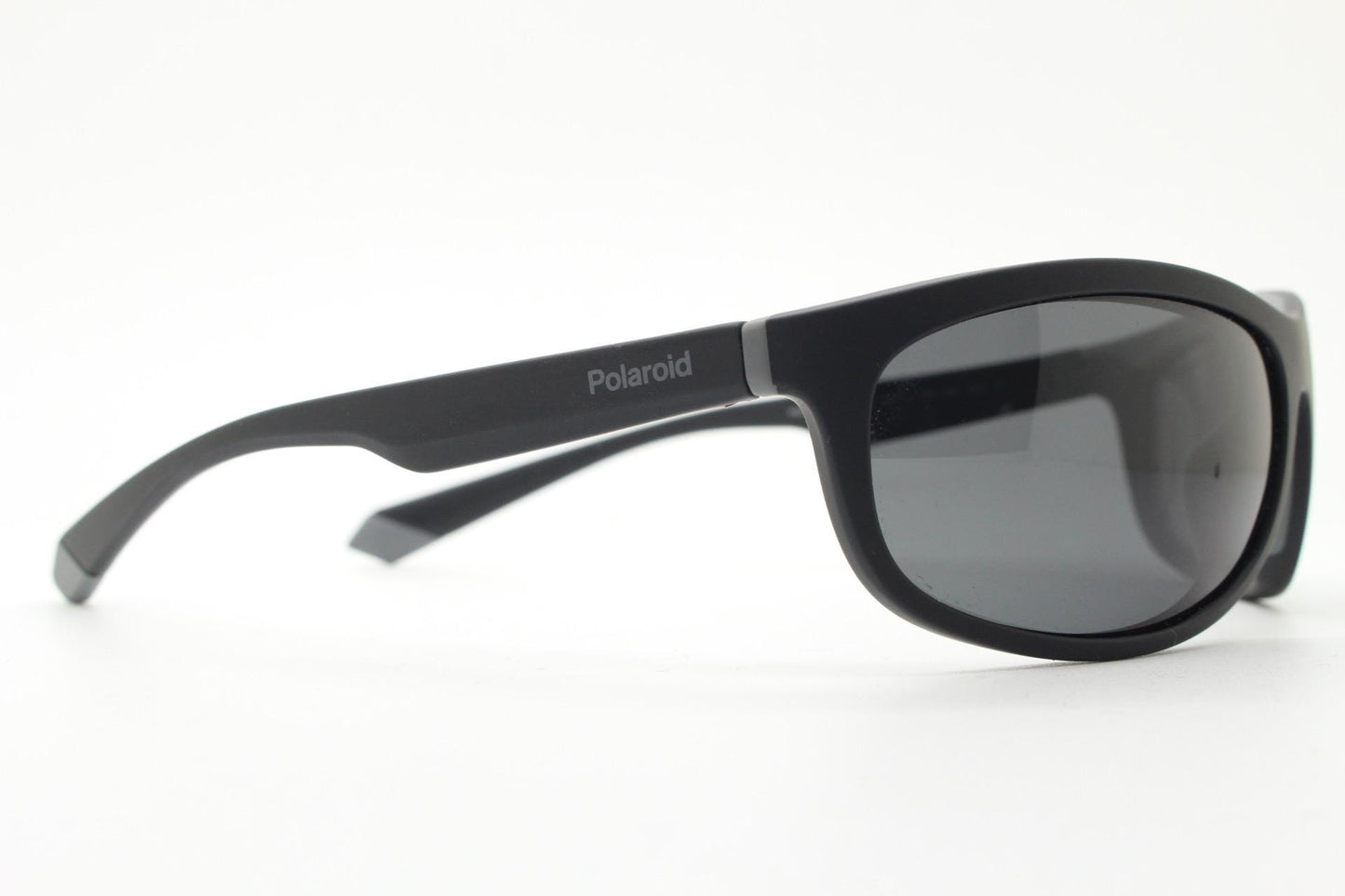 Polaroid vintage sports shield sunglasses. Black rubber finish curved wrap around frame with polarising lenses. 2000s. Y2K. Bug eye. NOS