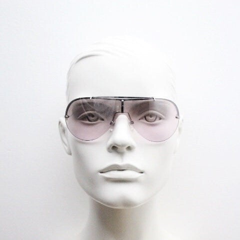 Y2K vintage visor shield sunglasses. Silver chrome half frame with pink wraparound mono lens and mirror glaze. Mini mask. 00's. 2000's NOS