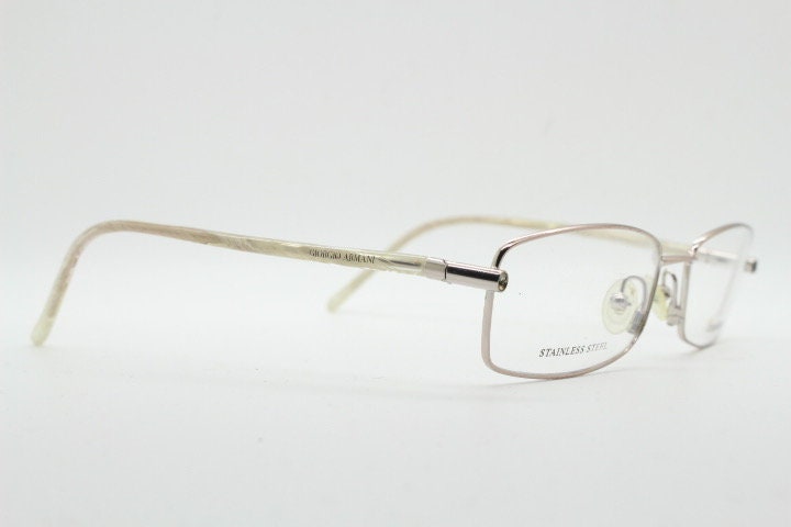 Giorgio Armani 90s vintage oval eye glasses made in Italy. Gold front with marbled white acetate arms. Optical frames. Prescription RX