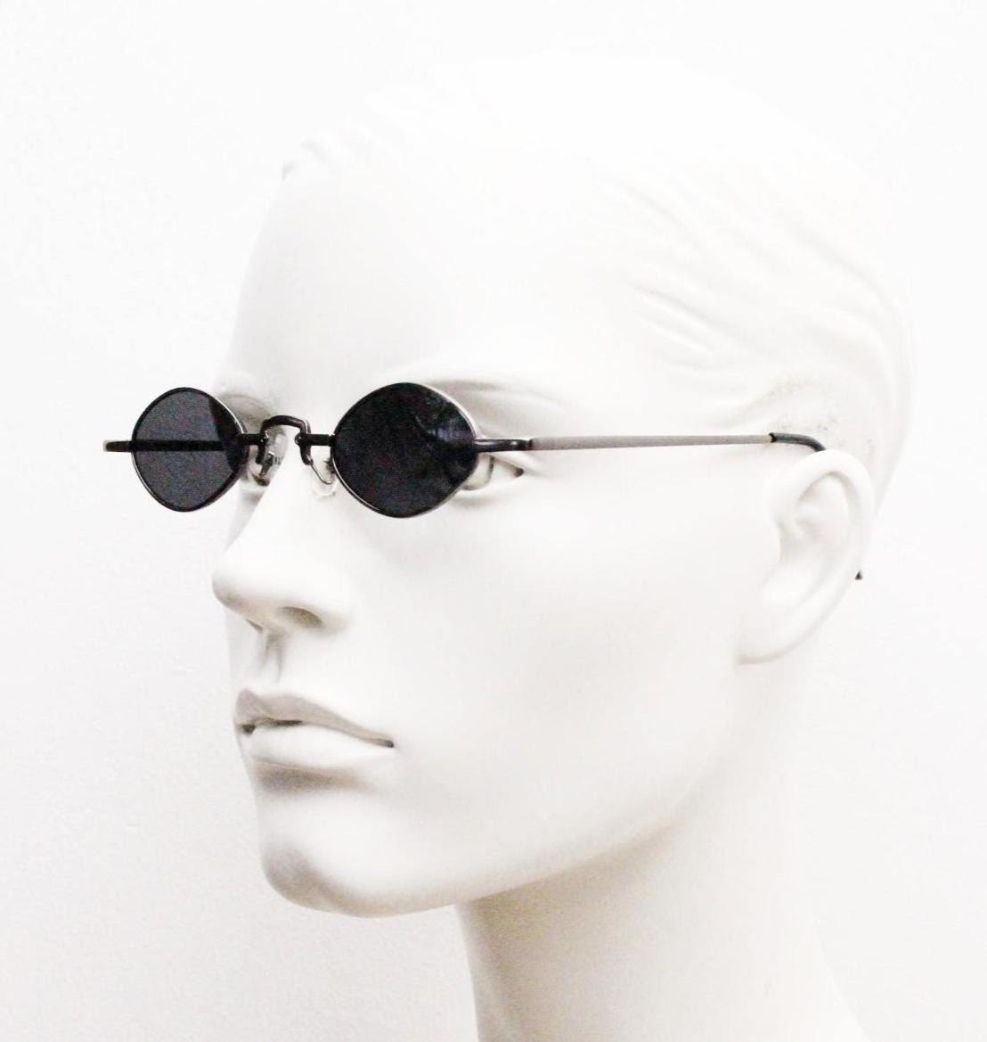 90s vintage small oval sunglasses. Imposing minimal gunmetal grey metal victorian style frame with black lenses. Steampunk. Unused BNWT