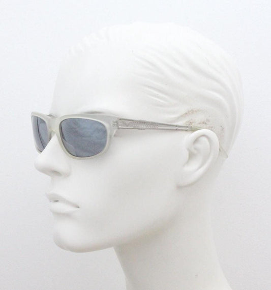 Dakota Smith vintage 90s futuristic sunglasses. Transparent frosted wrap around shield frame with mirror lenses and ornate arm patterns