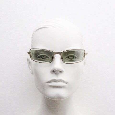 Y2K vintage wraparound sunglasses. Low profile satin finish golden slender frame with green lenses and gap feature. 2000's. 90s. NOS