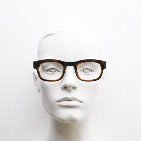 Anne et Valentin rectangular eye glasses hand made in France. Black matt titanium optical frame with mottled brown acetate. Prescription RX