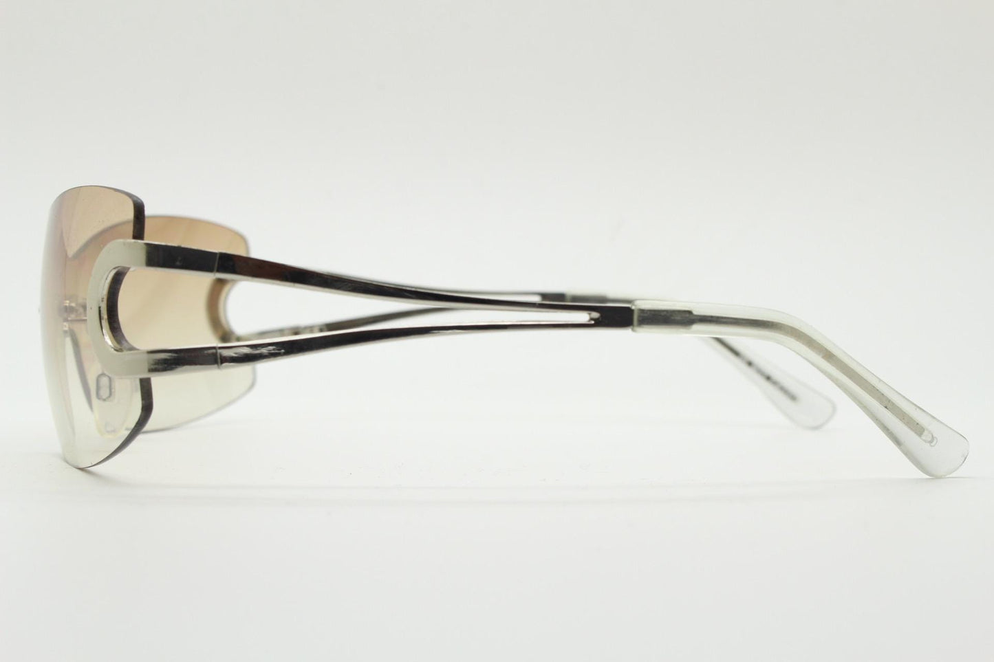 Y2K vintage visor sunglasses. 2000's brown wraparound mono lens shield design with looped chrome temples. 00s uber fashion mini mask NOS