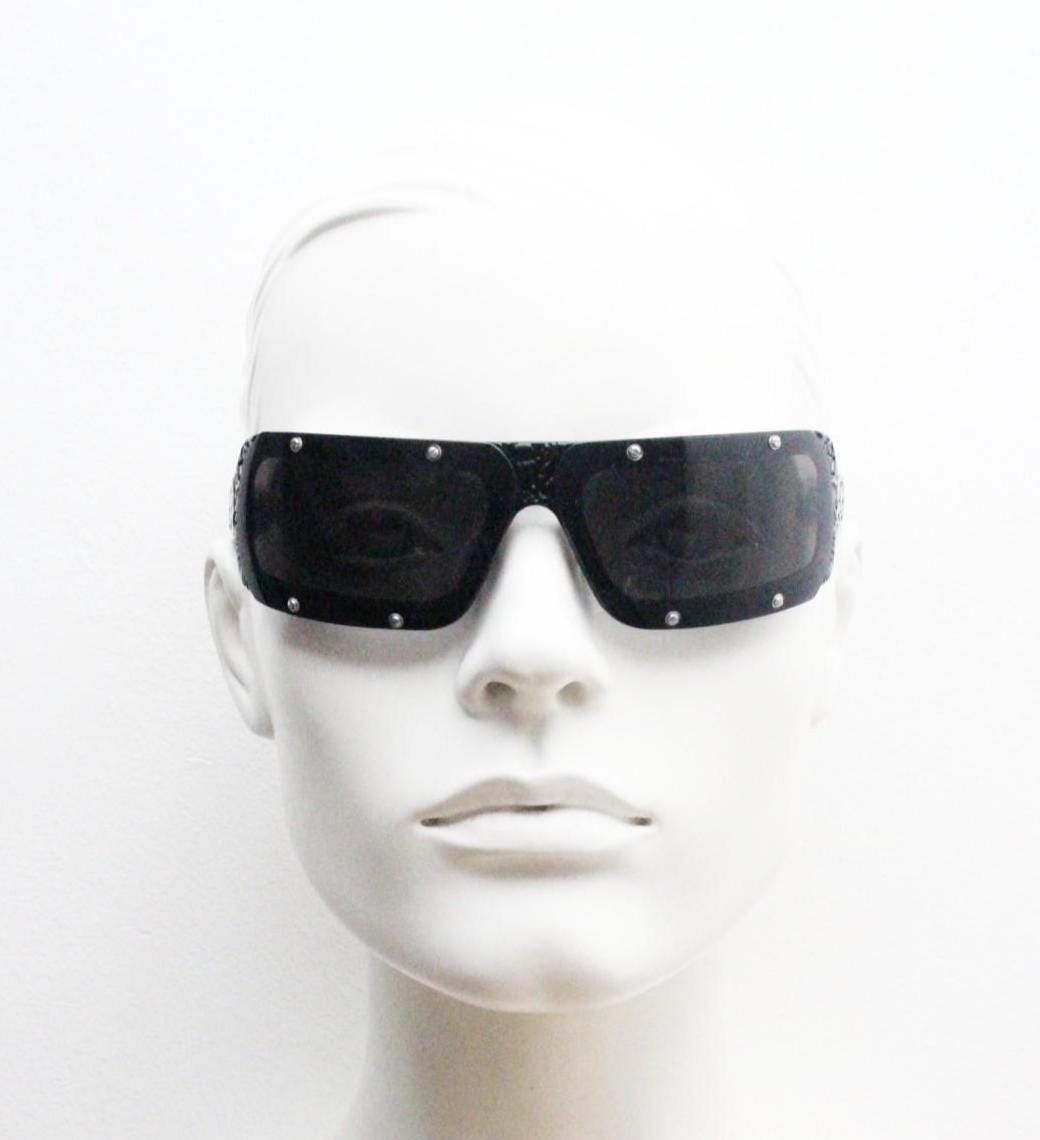 Buddhist Punk wrap around sunglasses hand made by Linda Farrow. Black acetate frame with abstract cut out patterns. Projects. Vintage. NOS