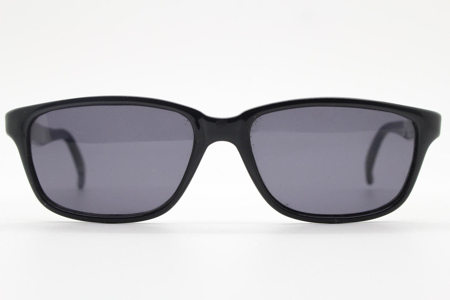 Vintage 90s slim rectangular modified wayfarer design sunglasses made in Italy. All black gloss low profile acetate frame. Unused NOS