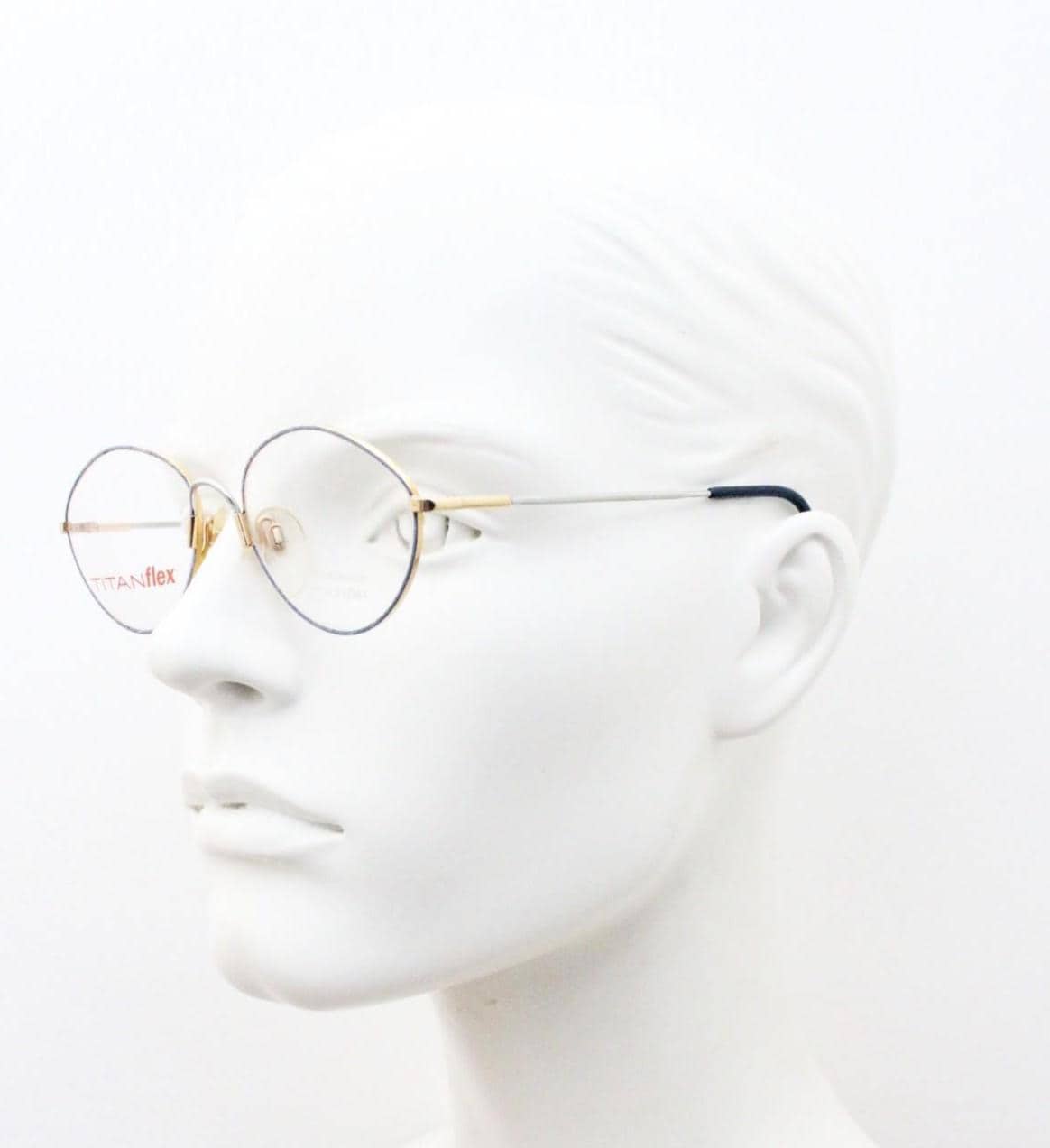 Eschenbach 90s vintage oval eye glasses made in Germany. Titanium optical frame with tasteful purple marbled front. Prescription NOS