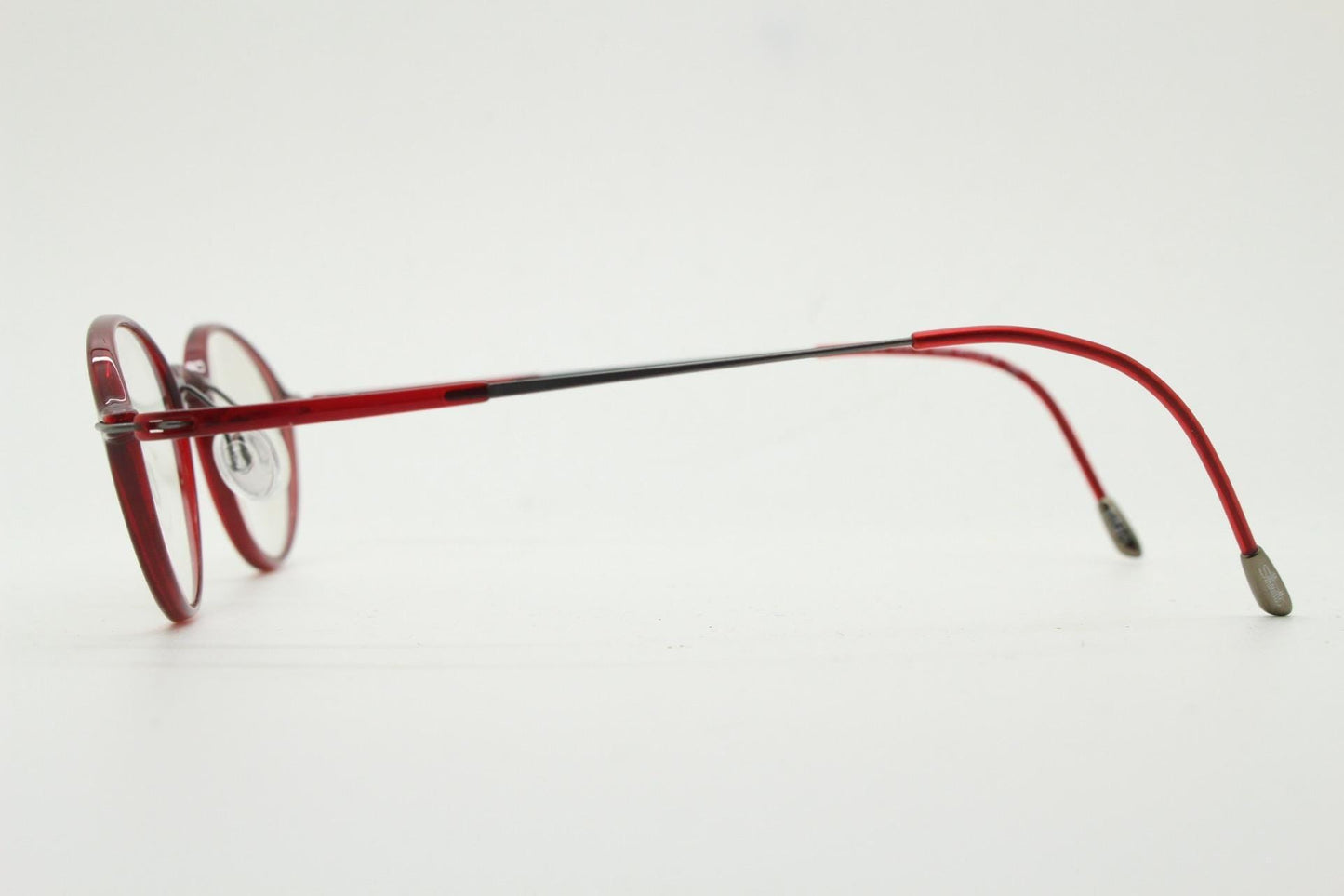 Silhouette rectangular frameless eye glasses made in Austria. Lightweight 1930s design with titanium. Red optical frame. Prescription RX