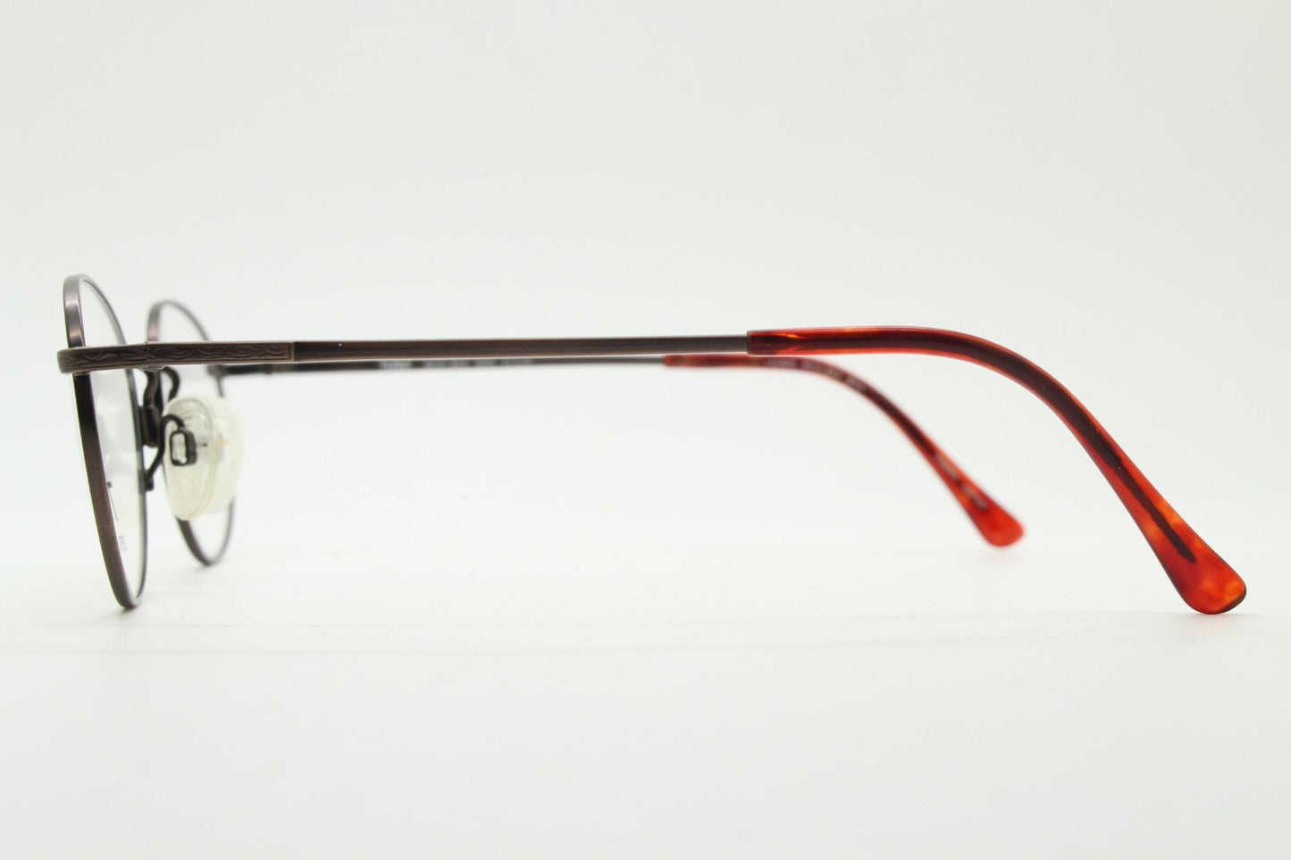 Tura 90s vintage oval eye glasses made in Japan. Satin metallic bronze finish optical frame in neat proportions. Prescription. Unused BNWT